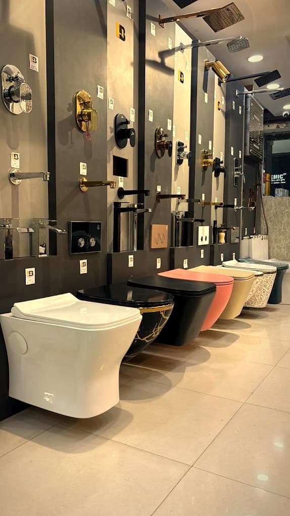 Toilets in a range of colours below wall-mounted faucets and mixers at Punjab Sanitary Store